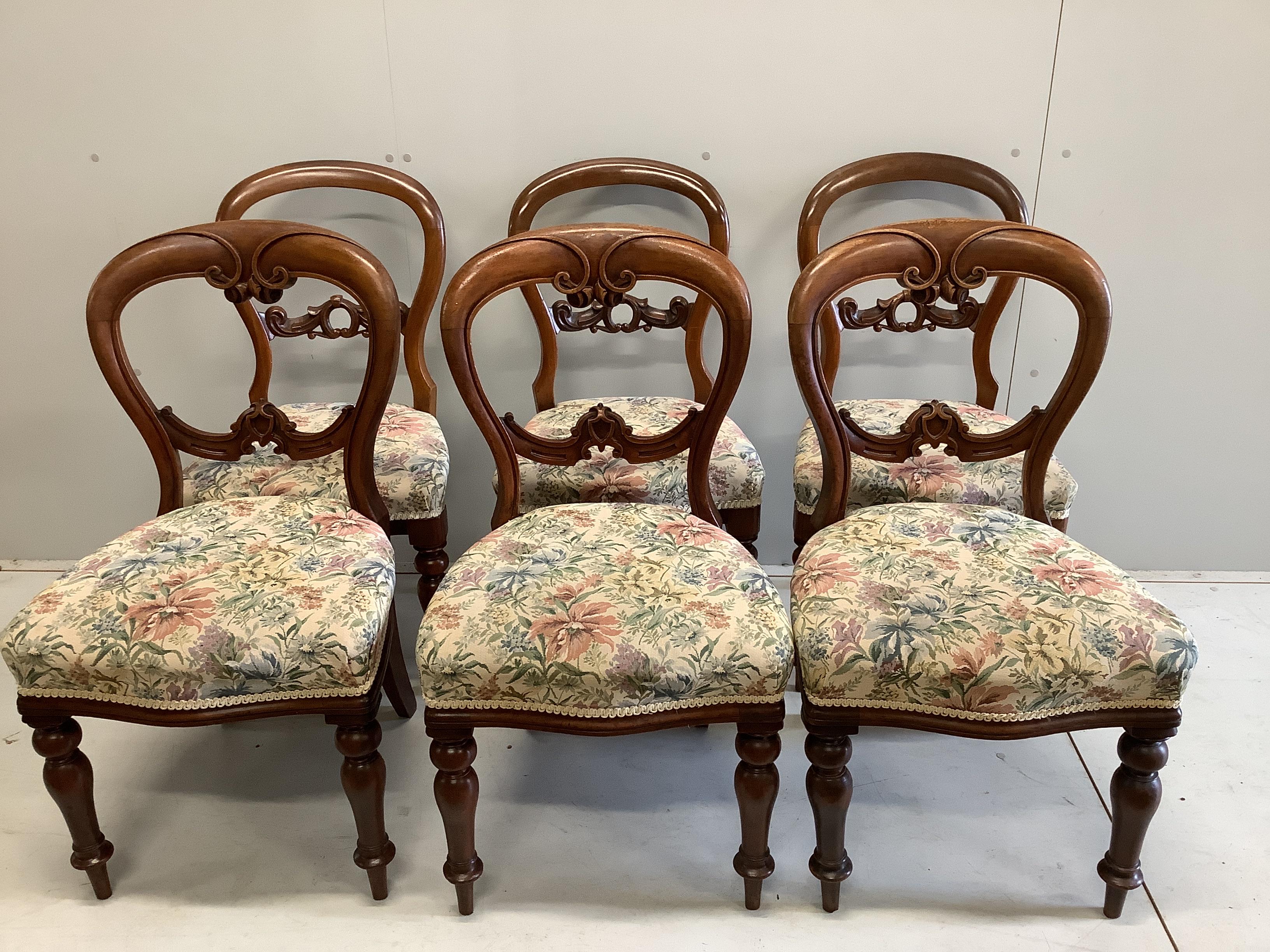 A Victorian circular mahogany tilt top breakfast table, diameter 134cm, height 71cm, together with a harlequin set of six balloon back dining chairs